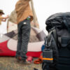 SPOT Gen4 Satellite GPS Messenger clipped to backpack with couple camping