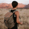 BareBones Edison Mini Lantern 3 pack hanging one on backpack while hiking