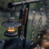 Barebones Edison Mini Lantern Bronze used during a cookout while camping