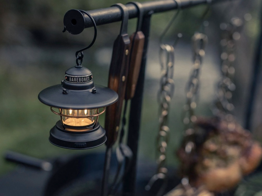 Barebones Edison Mini Lantern Bronze used during a cookout while camping